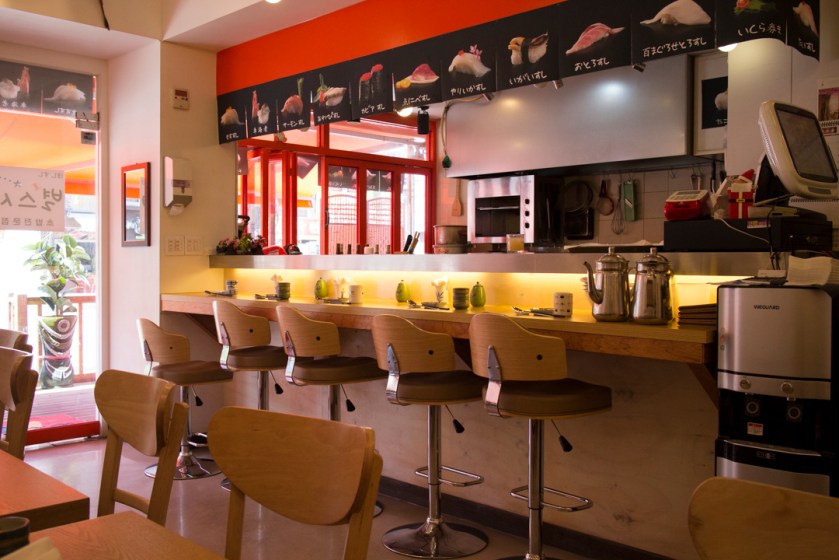 Small sushi bar with adjustable seats.